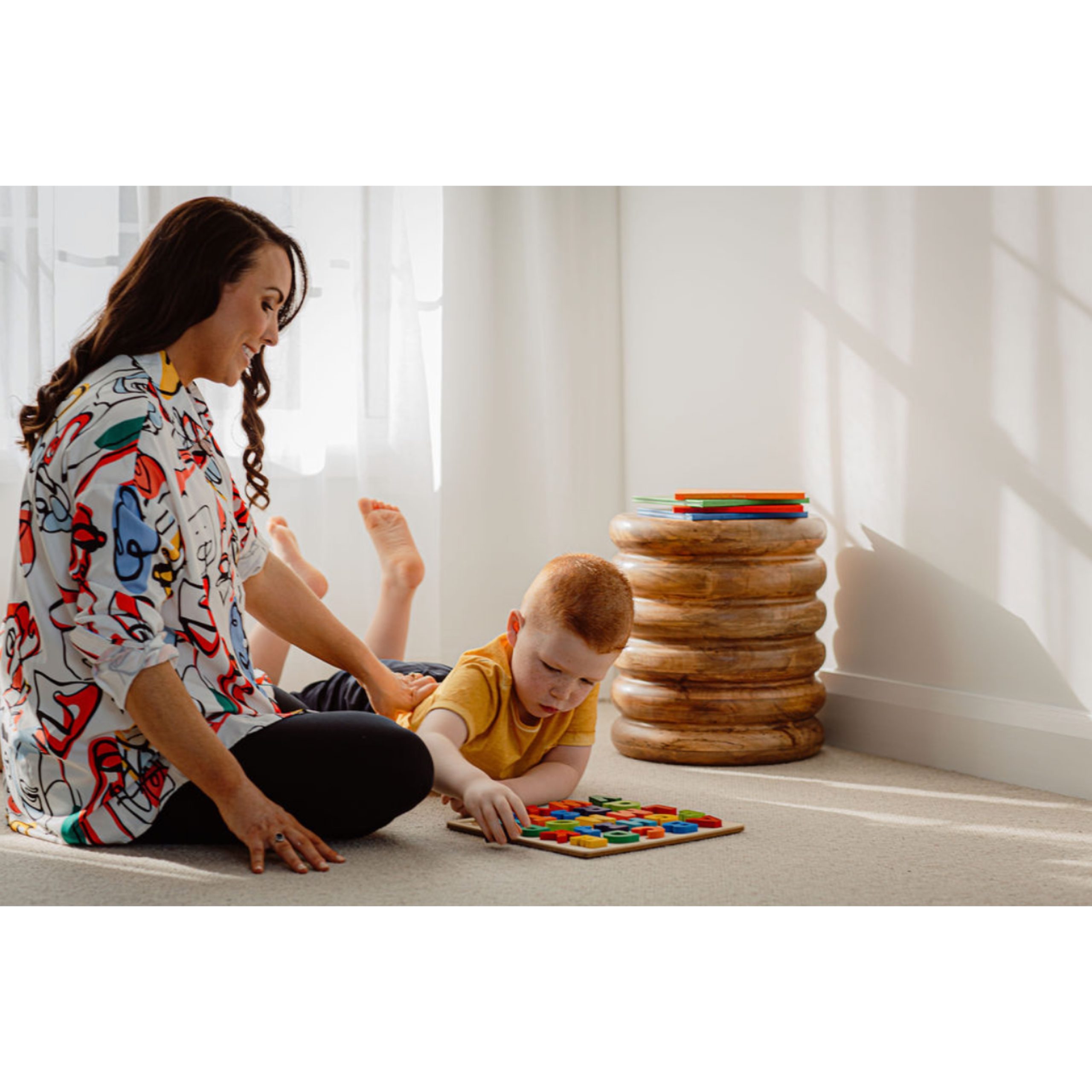 Photo of Claire Joyce working with a young boy as part of occupational therapy
